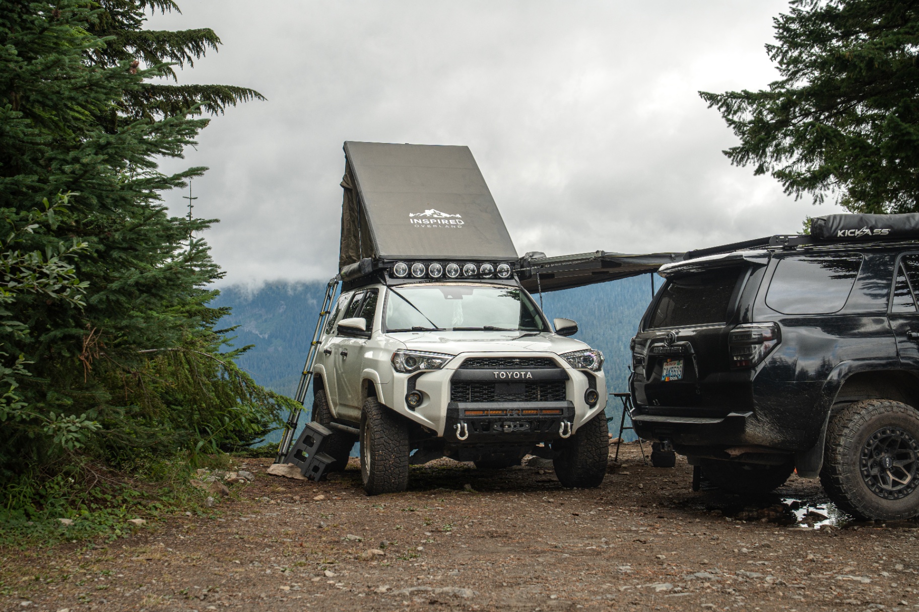 White 4Runner with Inspired Overland rooftop tent deployed at a mountain overlook