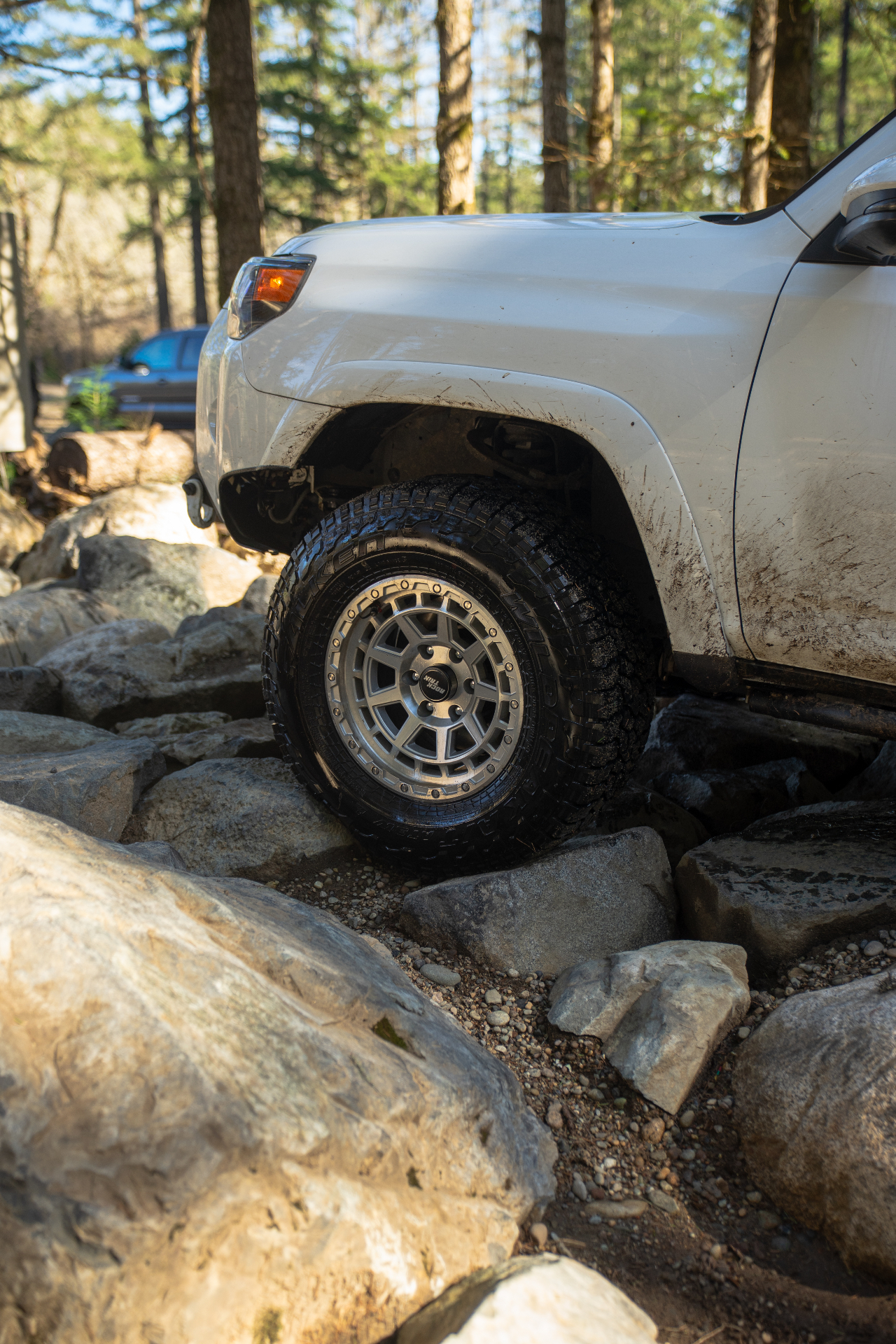 Rocktrix wheel on a 4Runner climbing rocks in the forest